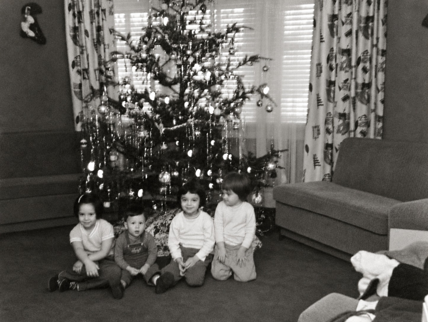 Four children beside a Christmas tree in Jim Sepe’s childhood family photograph